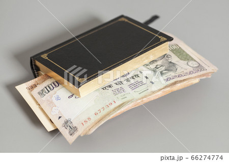Book with Indian Currency Rupee bank notes Book with Indian Currency Rupee bank notes 66274774