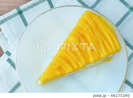 Delicious Mango Layer Cake on A Dish 66275260