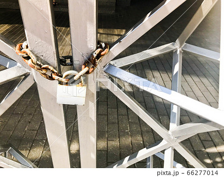Iron gates, metal bar fence frozen on a strong Iron gates, metal bar fence frozen on a strong 66277014