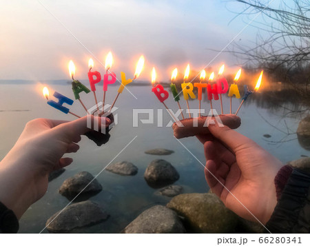 Burning happy birthday inscription made Burning happy birthday inscription made 66280341