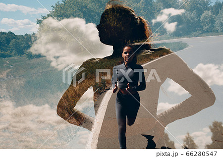 Running girl in city park. Young woman runner outdoor jogging. In-camera multiple exposure image. 66280547