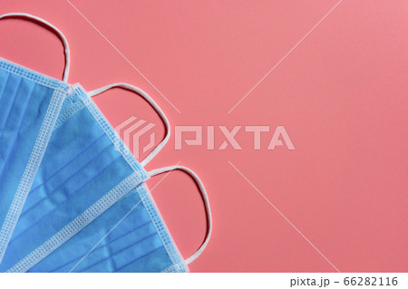 Medical mask on pink background Covid 19 66282116