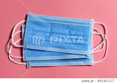 Medical mask on pink background Covid 19 66282117