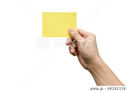 Hand holding yellow paper isolated on white with 66282158