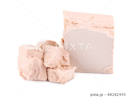 Fresh pressed yeast, isolated on white background. Fresh pressed yeast, isolated on white background. 66282445