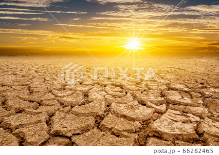 arid Clay soil Sun desert global worming concept cracked scorched earth soil drought desert landscape dramatic sunset arid Clay soil Sun desert global worming concept cracked scorched earth soil drought desert landscape dramatic sunset 66282465
