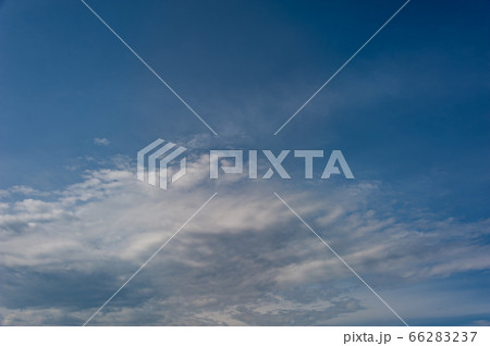 Natural sky composition. Sunny vast blue sky abstract background. Beautiful cloudscape, view over white fluffy clouds. Freedom concept, on the heaven. Element of design. 66283237