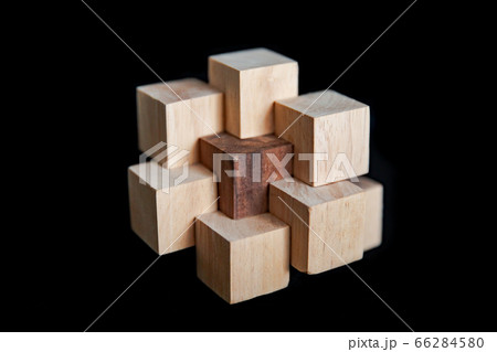Hand made wooden puzzles on a black background, art of wood 66284580