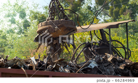 Image of metal scrap and waste stcking to the electric magnet on dump Image of metal scrap and waste stcking to the electric magnet on dump 66284969