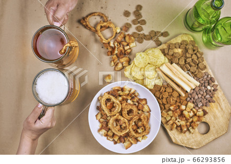 Drinking beer. Table full of beer snacks 66293856