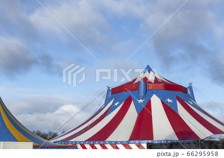 Red and white circus tent topped with bleu starred Red and white circus tent topped with bleu starred 66295958