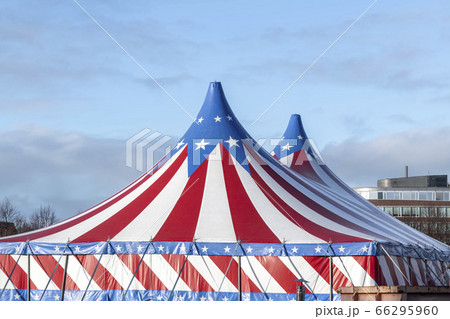 Red and white circus tent topped with bleu starred 66295960