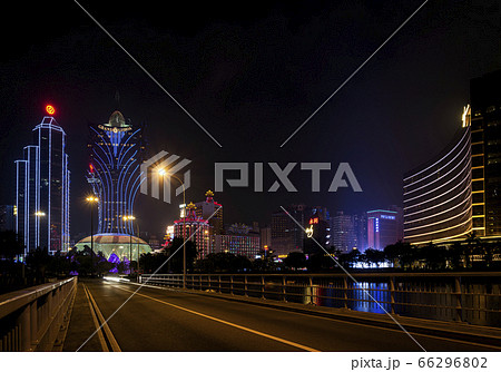 view of casino buildings at night in macau city 66296802
