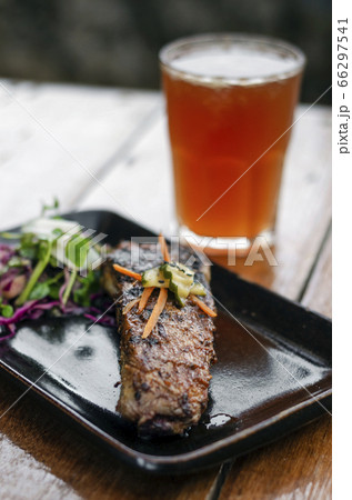 marinated grilled barbecue pork rib with salad 66297541