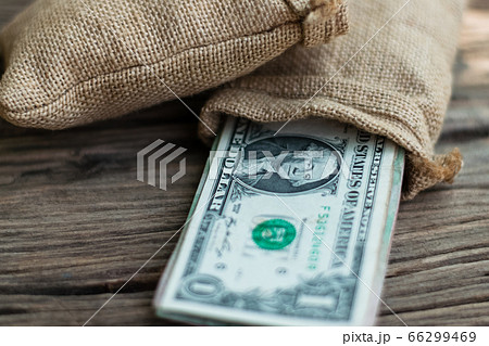 Stacked one dollar bills 66299469