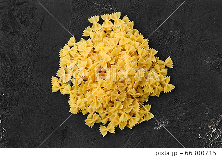 Download Top view of raw farfalle pasta with spice and...の写真素材 ... Yellowimages Mockups