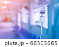 Saline iv bag intravenous drip hospital room,Medical Concept,treatment and injection vitamin natural drug infusion care chemotherapy concept.green light background hospital,Selective focus 66303665