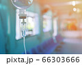 Saline iv bag intravenous drip hospital room,Medical Concept,treatment and injection vitamin natural drug infusion care chemotherapy concept.green light background hospital,Selective focus 66303666
