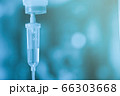 Saline iv bag intravenous drip hospital room,Medical Concept,treatment and injection vitamin natural drug infusion care chemotherapy concept.green light background hospital,Selective focus 66303668