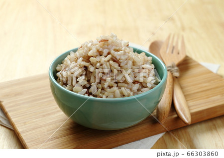 Brown Rice on Wooden Plate 66303860