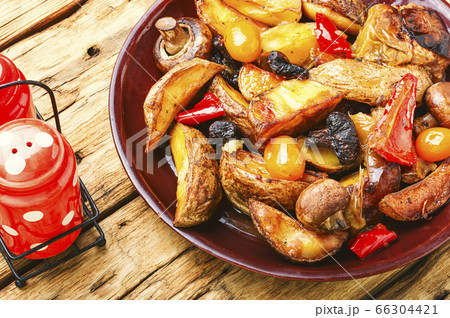 Fried potatoes with mushrooms 66304421