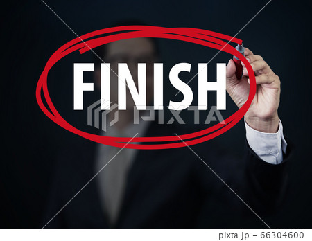 Businessman hand writing "FINISH" with red marker 66304600