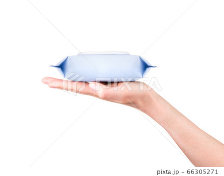 Woman hand holding package of wet wipes or tissue isolated on a white background 66305271