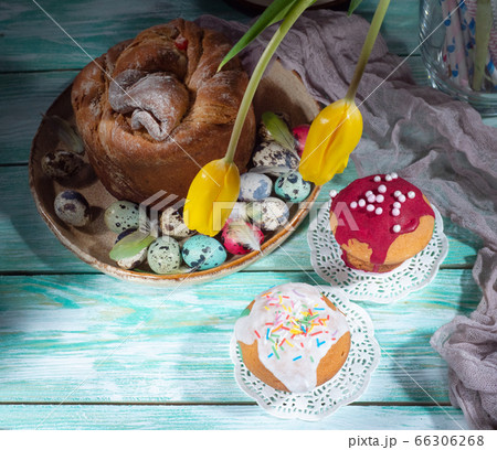 Easter composition with colorful eggs and cakes Easter composition with colorful eggs and cakes 66306268