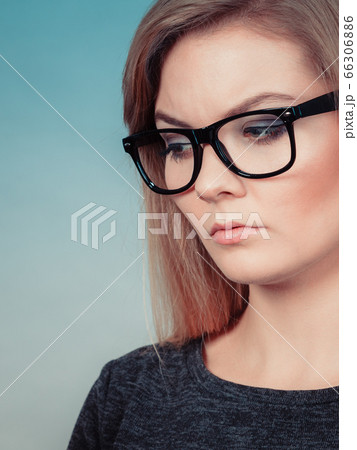 Closeup of woman thinking face expression Closeup of woman thinking face expression 66306886