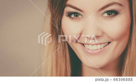 Portrait of happy blonde woman smiling with joy Portrait of happy blonde woman smiling with joy 66306888
