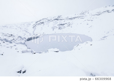 Kerid volcano crater during winter snow in Iceland Kerid volcano crater during winter snow in Iceland 66309968