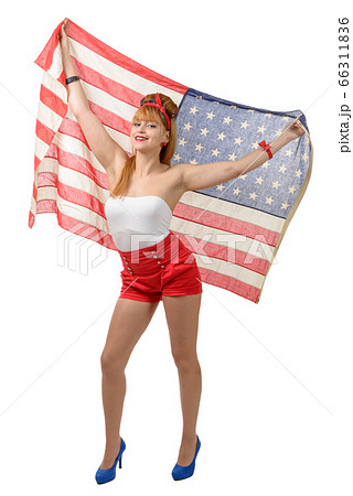 Sexy pin up girl  holding an American flag. 66311836