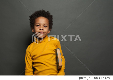 Portrait of black child student with book Portrait of black child student with book 66317329