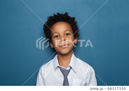 Handsome little black child boy portrait on blue 66317330