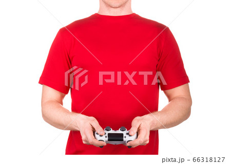 Man in red t-shirt holding gamepad and playing video games isolated white Man in red t-shirt holding gamepad and playing video games isolated white 66318127