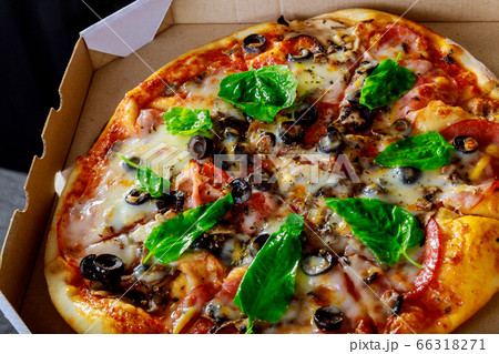 Delicious fresh with tasty pizza on black olives Delicious fresh with tasty pizza on black olives 66318271