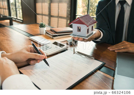 Customer writing signing signature on paper Customer writing signing signature on paper 66324106