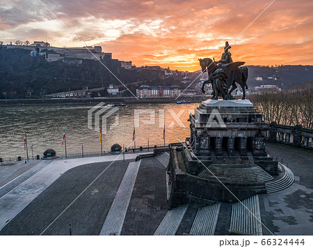 Colorful Sunrise burning sky Koblenz City historic monument German Corner where river rhine and mosele flow together Colorful Sunrise burning sky Koblenz City historic monument German Corner where river rhine and mosele flow together 66324444