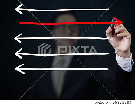 Businessman drawing arrows in different Businessman drawing arrows in different 66325584