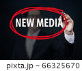 Businessman hand writing "NEW MEDIA" with red 66325670