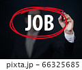 Businessman hand writing "JOB" with red marker on 66325685