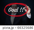 Businessman hand writing "Goal" with red marker on 66325686