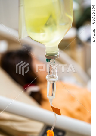 Close up of saline with woman patient in hospital Close up of saline with woman patient in hospital 66325904