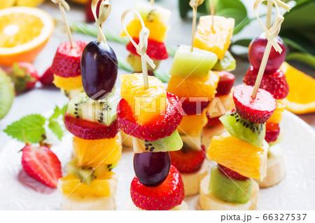 Fresh fruit on skewers. Concept buffet for a Fresh fruit on skewers. Concept buffet for a 66327537