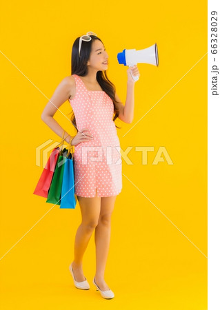 asian woman with colorful shopping bag with smart mobile phone and credit card asian woman with colorful shopping bag with smart mobile phone and credit card 66328029
