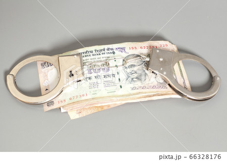 Indian Currency Rupee Notes and Handcuffs Indian Currency Rupee Notes and Handcuffs 66328176