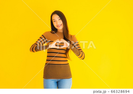 asian woman work from home with laptop cash and cardboard box ready for shipping of online asian woman work from home with laptop cash and cardboard box ready for shipping of online 66328694
