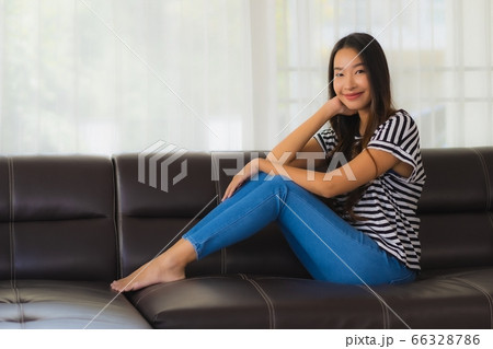 asian woman work from home with laptop cash and cardboard box ready for shipping of online asian woman work from home with laptop cash and cardboard box ready for shipping of online 66328786