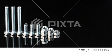 shiny metal bolts and nuts of different sizes on a 66331495