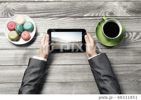 Businesswoman having coffee break 66331851